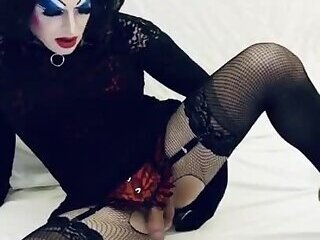 Sissy slut in heavy makeup fucks her toys for her Master